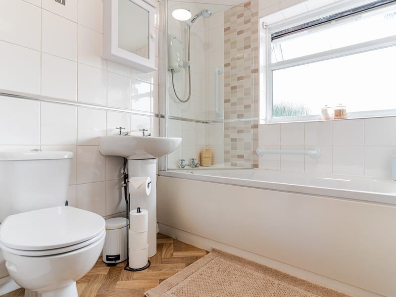 Clean modern bathroom with bath