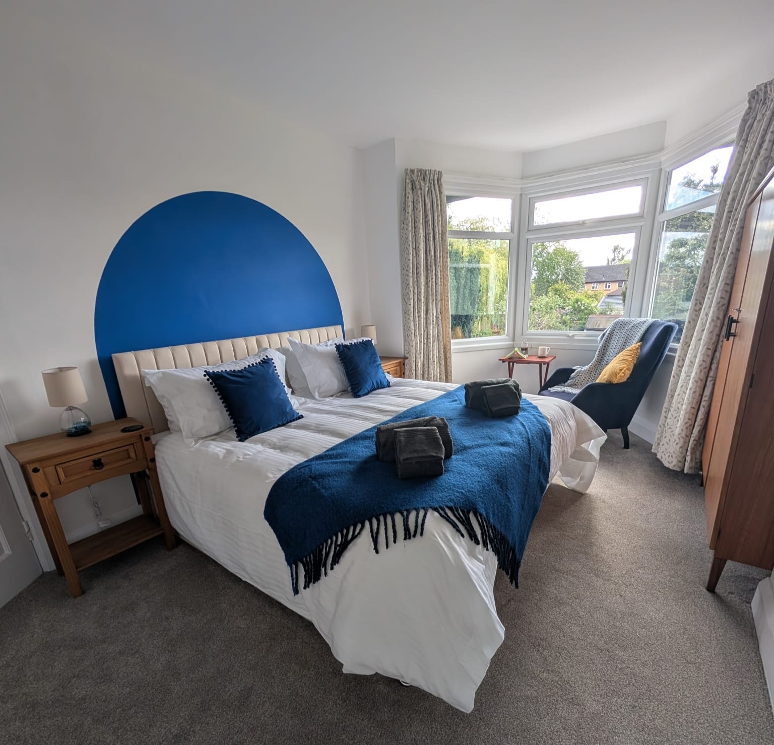 Bedroom 1 wide shot showing bay window and full room